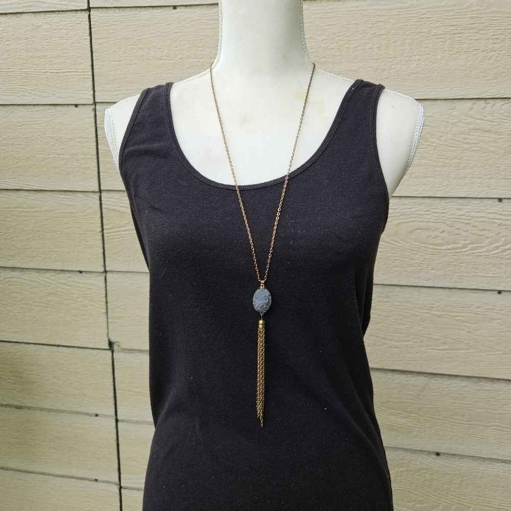 long gold tone chain necklace with gray druzy and chain tassel pendant